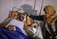 Ağzına gaz bombası isabet eden Filistinli, Gazze'den çıkmayı bekliyor