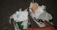 Ayakkabısının içine sakladığı sahte parayı polis buldu