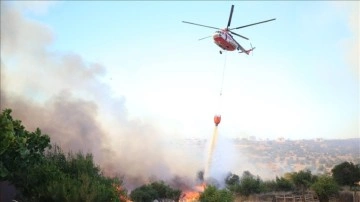 Çanakkale'de çöplük alandan ormana sıçrayan yangının ilerlemesi durduruldu