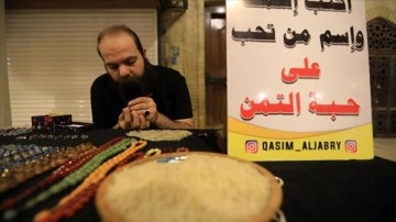 Iraklı genç hattat pirinç tanelerini sanat eserine dönüştürüyor