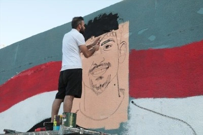 Iraklı grafiti sanat&ccedil;ısı 40 yıl sonra gelen D&uuml;nya Kupası sevincini Bağdat'ın duvarlarına taşıdı