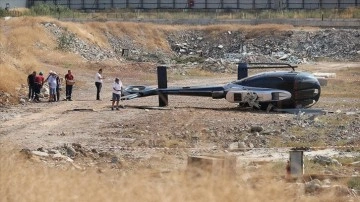 İzmir'de arızalanan helikopter boş araziye indiği sırada yan yattı