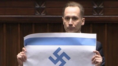 Polonyalı milletvekili Berkowicz, parlamentoda Nazi semboll&uuml; İsrail bayrağı a&ccedil;tı