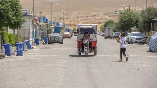 Irak&rsquo;ta m&uuml;lteci kampına ait pazar yerinde &ccedil;ıkan yangında 30'dan fazla iş yeri yandı